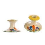 A PAIR OF BIZARRE BY CLARICE CLIFF CROCUS CANDLESTICKS