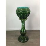 A 19TH CENTURY GREEN GLAZED MAJOLICA JARDINIERE ON STAND