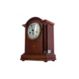 AN EARLY 20TH CENTURY INLAID OAK MANTEL CLOCK