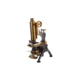 A BRASS MONOCULAR MICROSCOPE BY W. WATSON & SONS