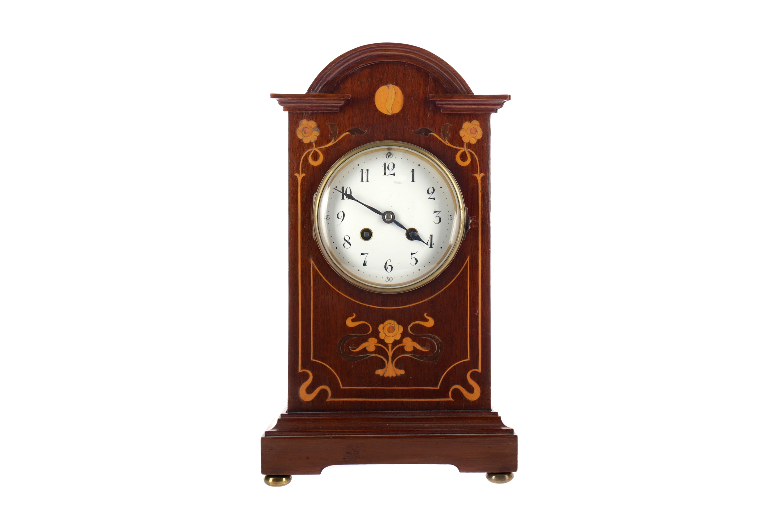 AN EDWARDIAN MAHOGANY MANTEL CLOCK