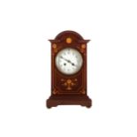 AN EDWARDIAN MAHOGANY MANTEL CLOCK