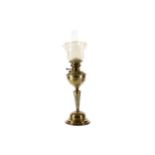 A LATE VICTORIAN BRASS OIL LAMP