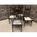 A SET OF FOUR MAHOGANY CHAIRS OF ARTS & CRAFTS DESIGN