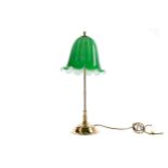 A BRASS TABLE LAMP WITH GREEN SHADE