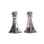 A PAIR OF ARTS & CRAFTS CANDLESTICKS