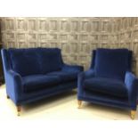 A BLUE TWO SEAT SETTEE AND ARMCHAIR