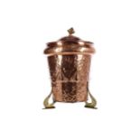 AN ARTS & CRAFTS HAMMERED COPPER COAL BIN AND COVER