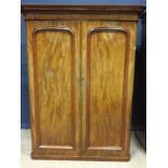 A VICTORIAN MAHOGANY TWO DOOR WARDROBE