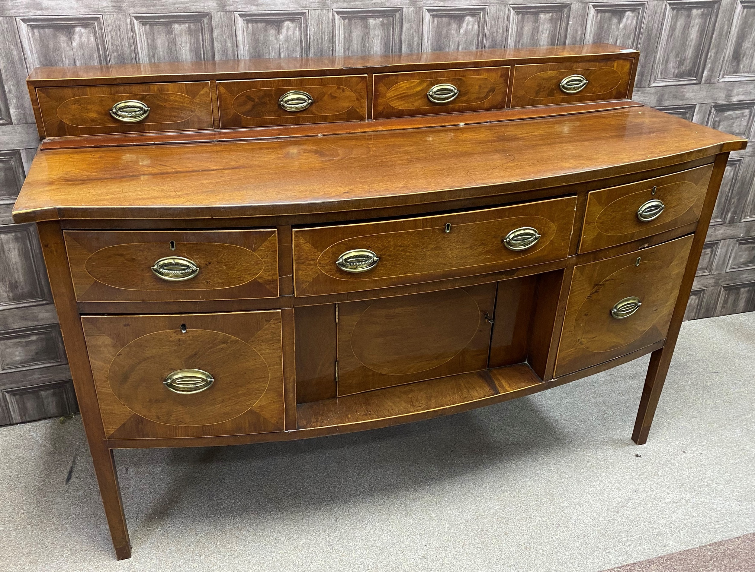 A REGENCY MAHOGANY BOW FRONTED SIDEBOARD