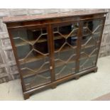 A MAHOGANY REPRODUCTION THREE DOOR BOOKCASE