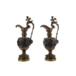 A PAIR OF LATE VICTORIAN RENAISANCE REVIVAL BRONZE EWERS