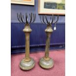 A PAIR OF CAST IRON PEDESTALS