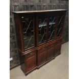 A REPRODUCTION MAHOGANY BREAKFRONT BOOKCASE