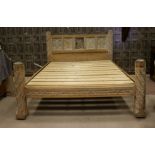 A LIMED OAK BEDSTEAD OF GOTHIC DESIGN