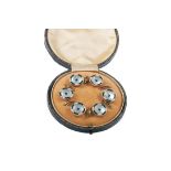A SET OF SIX EDWARDIAN GREEN GEMSTONE AND MOTHER OF PEARL SHIRT STUDS