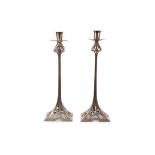 A PAIR OF SILVER PLATED BRASS SECESSIONIST CANDLESTICKS