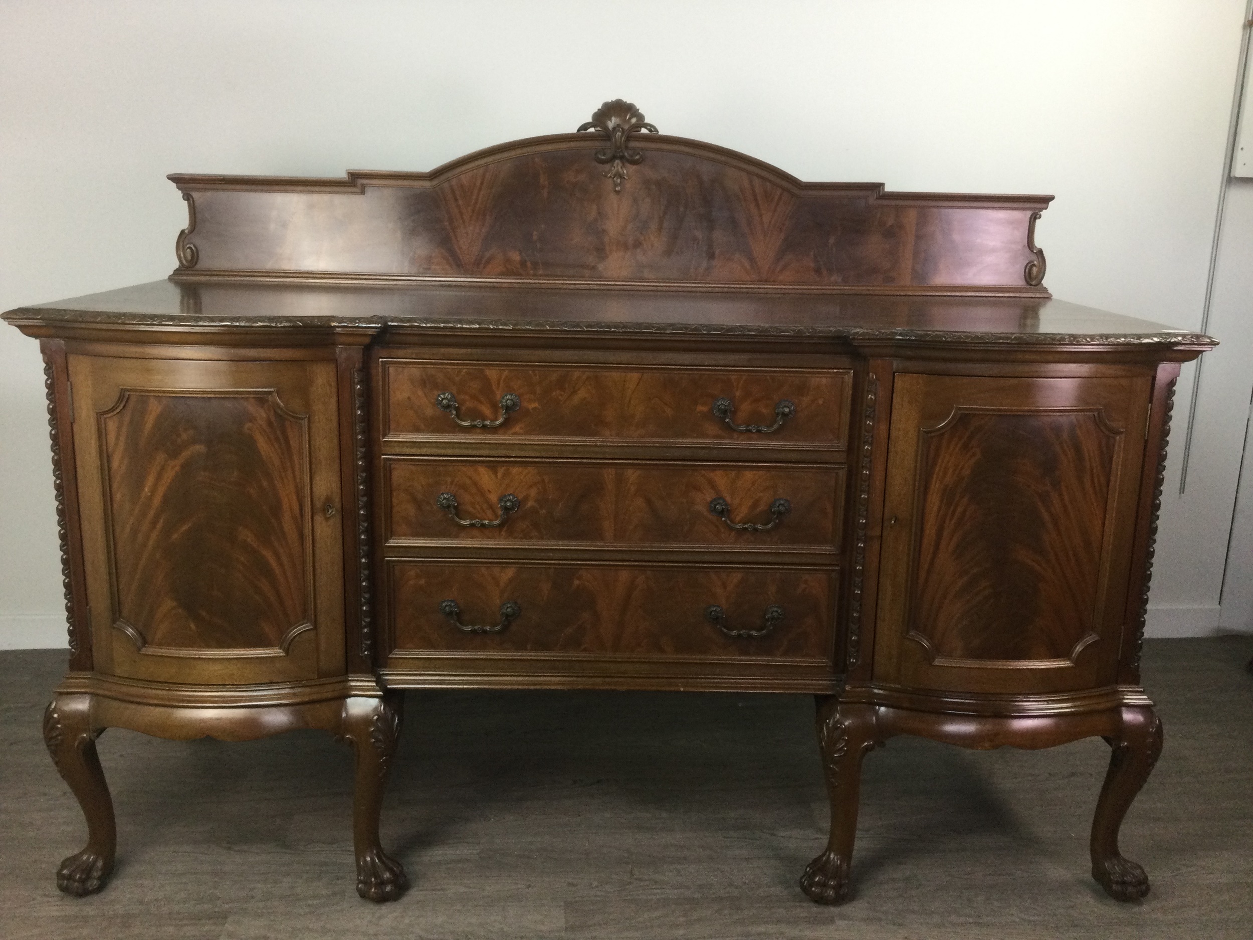 A MAHOGANY SIDEBOARD OF CHIPPENDALE DESIGN