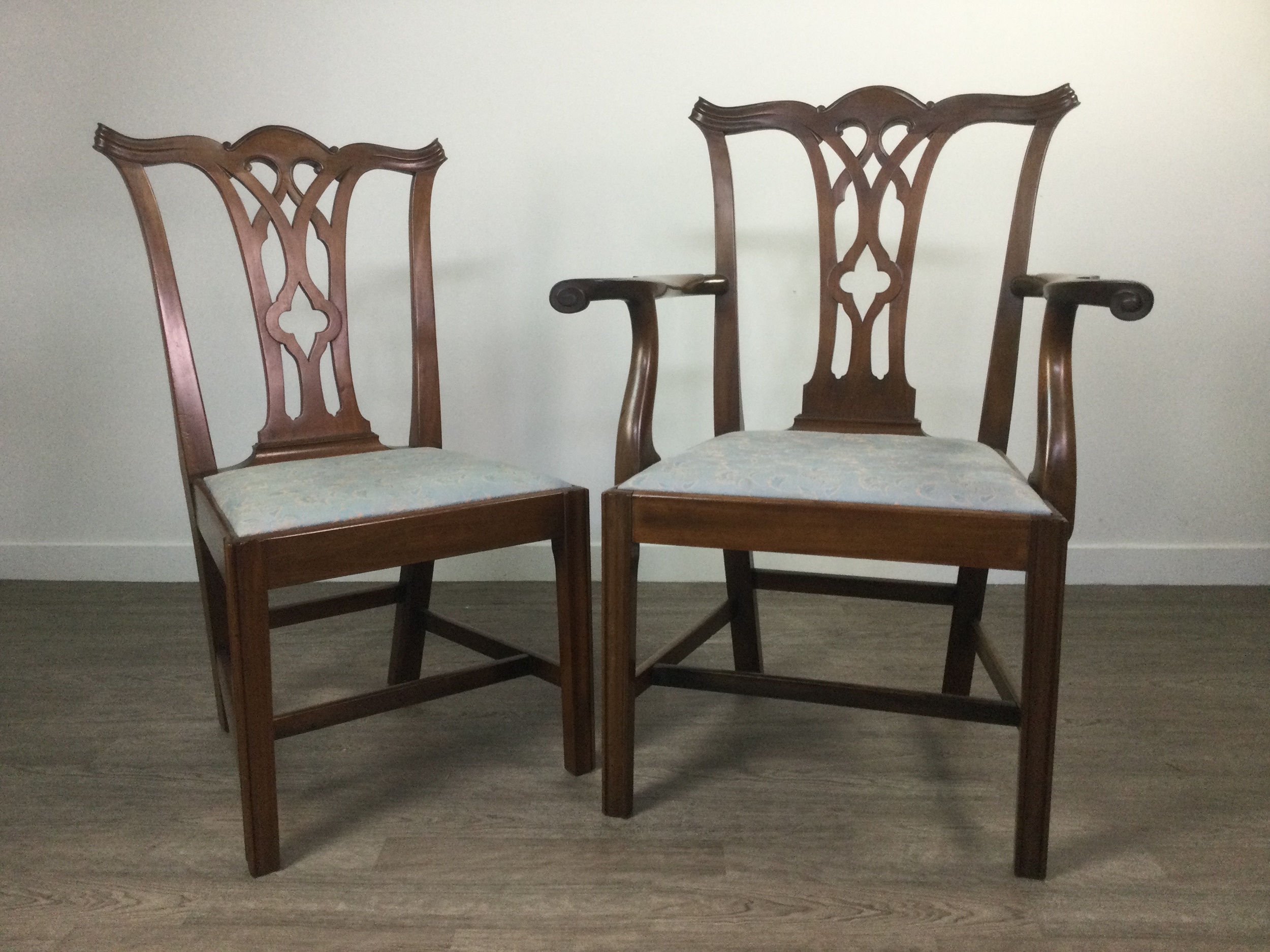 A SET OF EIGHT MAHOGANY DINING CHAIRS OF CHIPPENDALE DESIGN