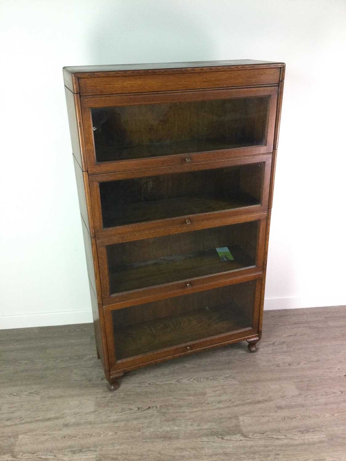 AN EARLY 20TH CENTURY BARRISTER’S OAK SECTIONAL BOOKCASE