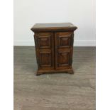 A LATE VICTORIAN OAK APPRENTICE TABLETOP CABINET