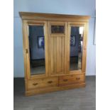 A VICTORIAN STRIPPED PINE DOUBLE WARDROBE