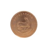 A GOLD KRUGERRAND DATED 1974