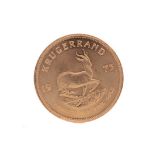 A GOLD KRUGERRAND DATED 1975