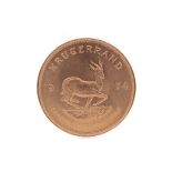 A GOLD KRUGERRAND DATED 1974