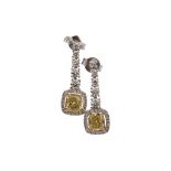 A PAIR OF GIA CERTIFICATED FANCY YELLOW DIAMOND EARRINGS