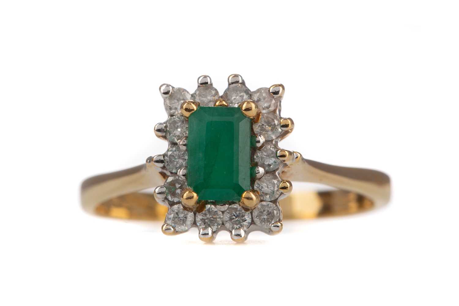 AN EMERALD AND DIAMOND RING