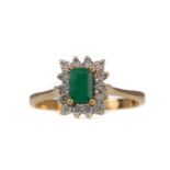 AN EMERALD AND DIAMOND RING