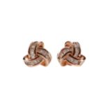 A PAIR OF DIAMOND KNOT EARRINGS