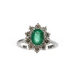 AN EMERALD AND DIAMOND RING