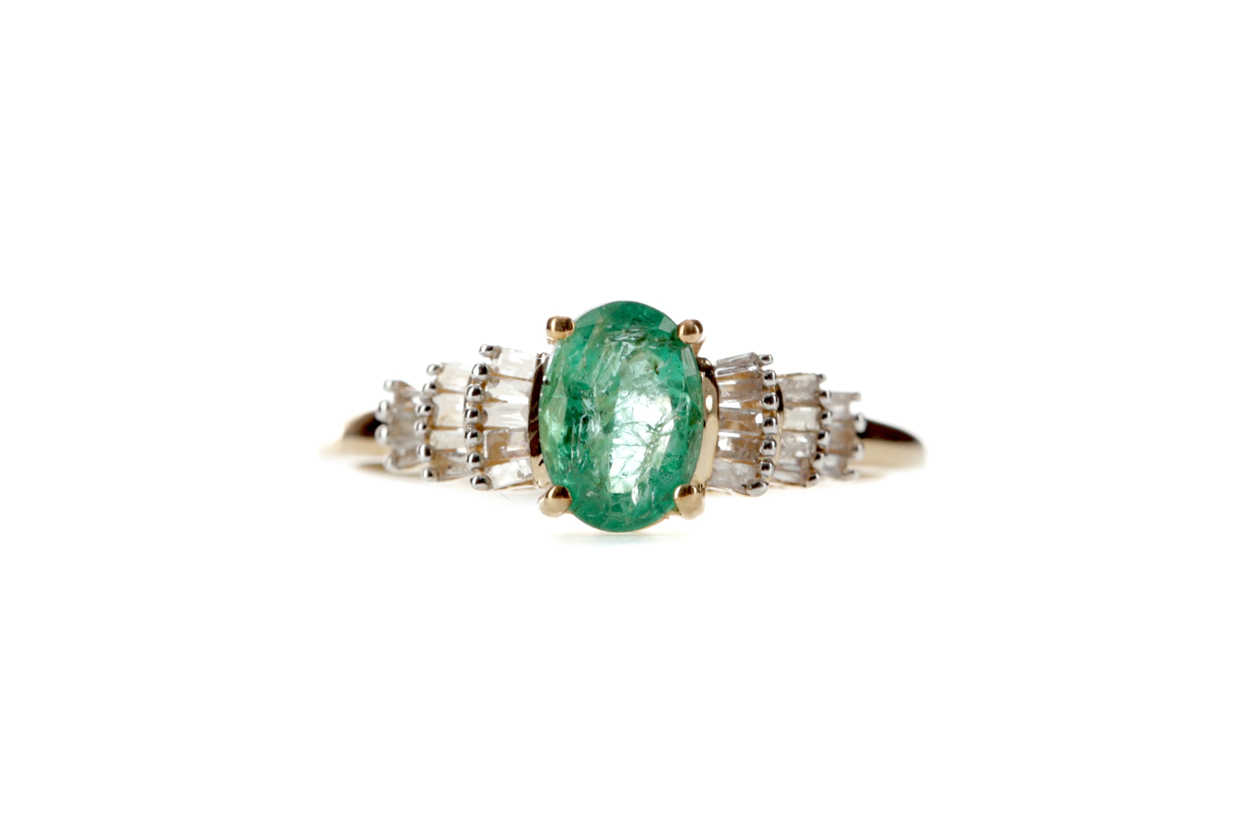 AN EMERALD AND DIAMOND RING