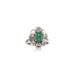 AN EMERALD AND DIAMOND RING