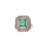 AN EMERALD AND DIAMOND RING