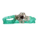 AN EMERALD AND BLACK DIAMOND BRACELET