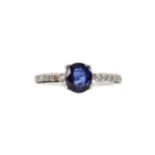 A SAPPHIRE AND DIAMOND RING