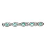 AN EMERALD AND DIAMOND BRACELET