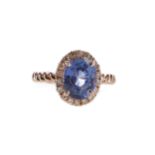 A SAPPHIRE AND DIAMOND RING