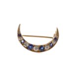 A SAPPHIRE AND DIAMOND CRESCENT MOON BROOCH