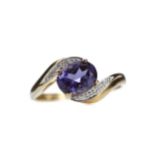 AN IOLITE AND DIAMOND RING