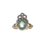 AN EMERALD AND DIAMOND RING