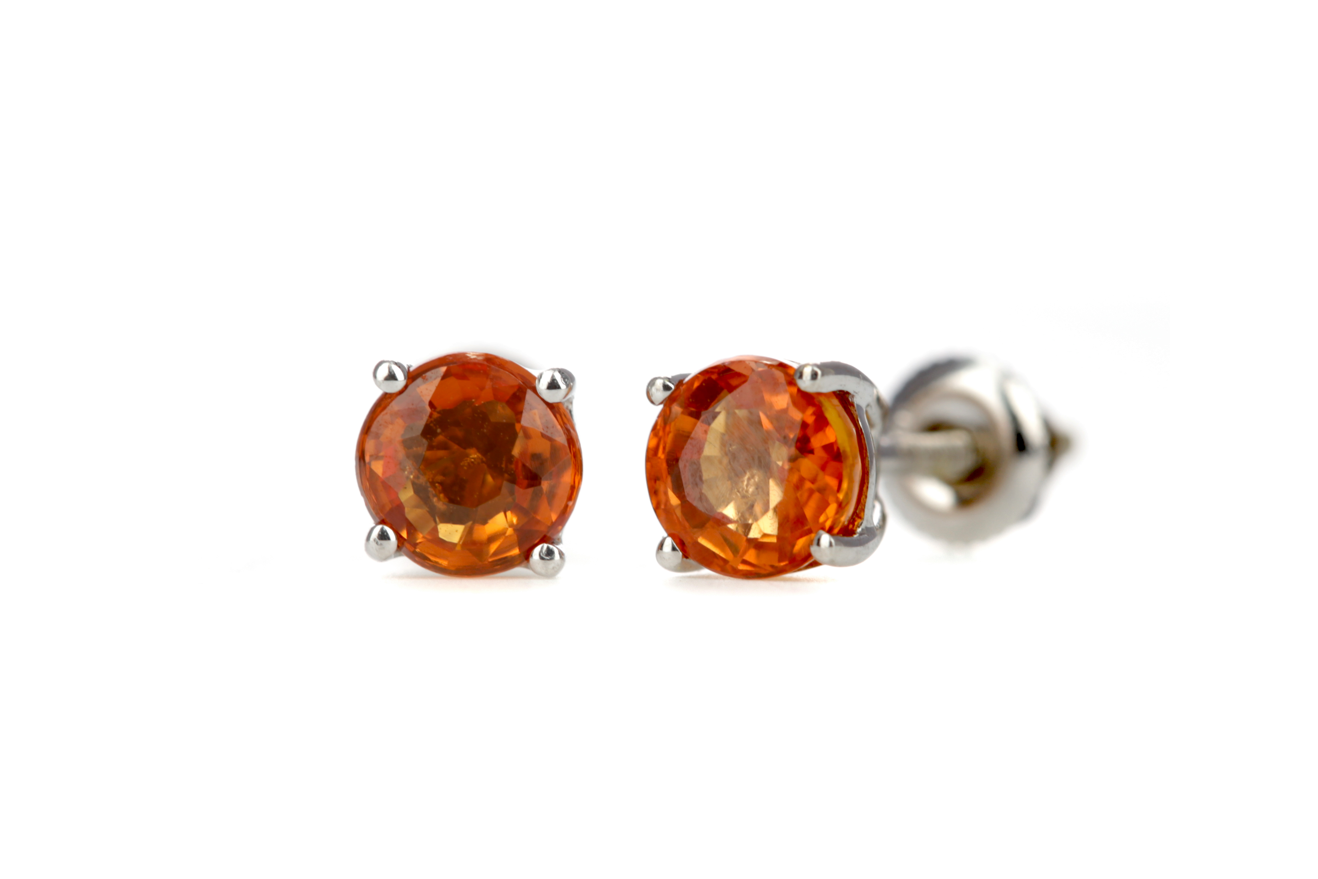 A PAIR OF TREATED ORANGE SAPPHIRE STUD EARRINGS