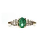 AN EMERALD AND DIAMOND RING