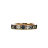 A BLUE GEM SET AND DIAMOND HALF ETERNITY RING