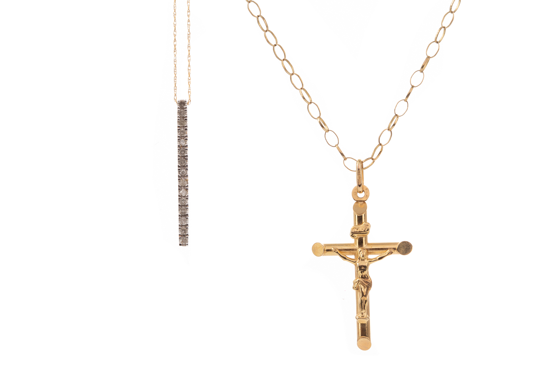 A NINE CARAT GOLD CRUCIFIX ALONG WITH A PENDANT