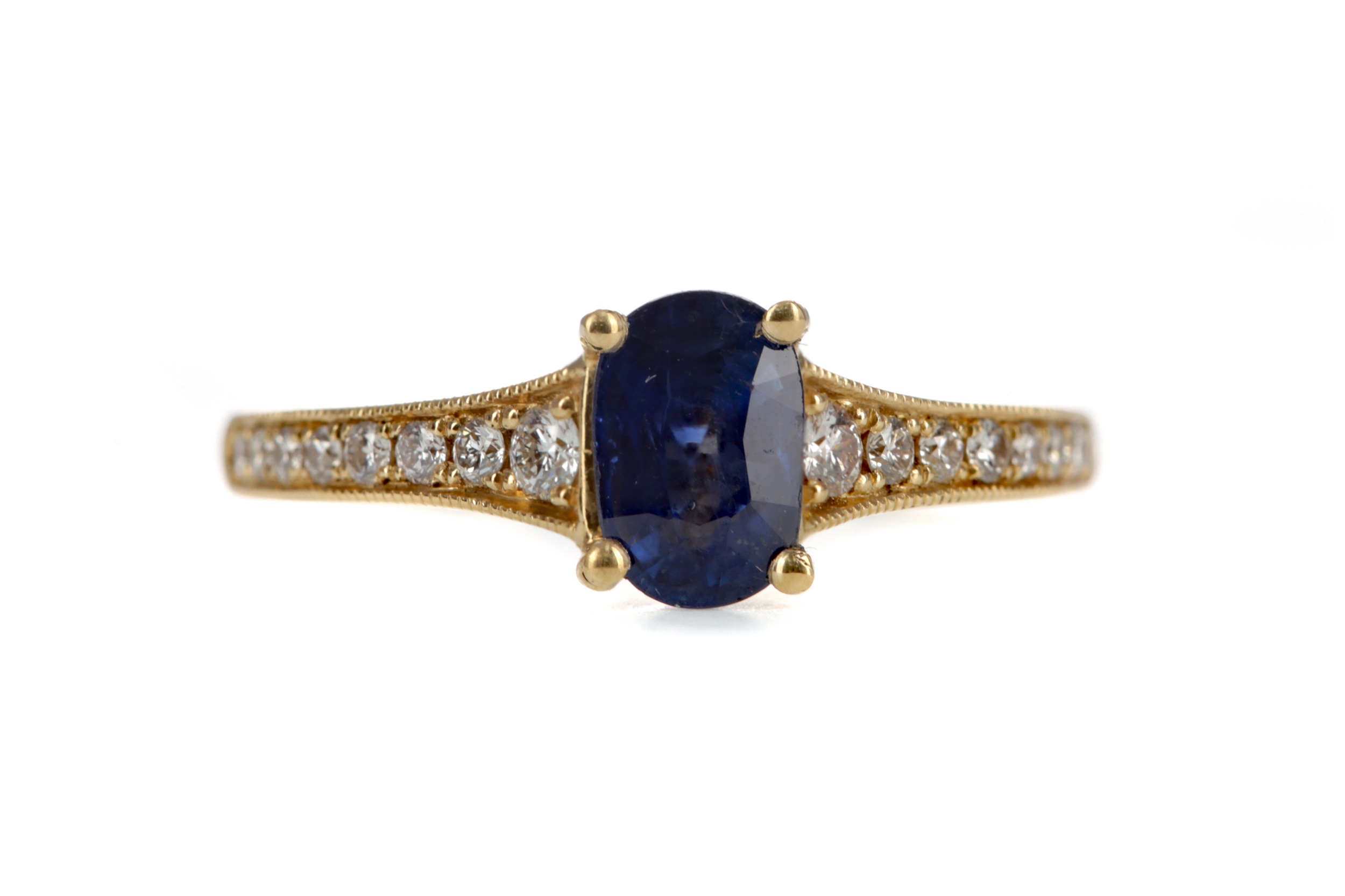 A SAPPHIRE AND DIAMOND RING