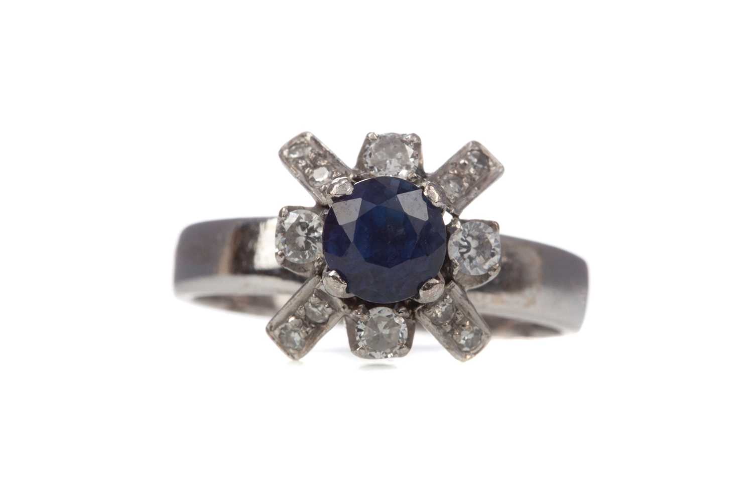 A SAPPHIRE AND DIAMOND RING